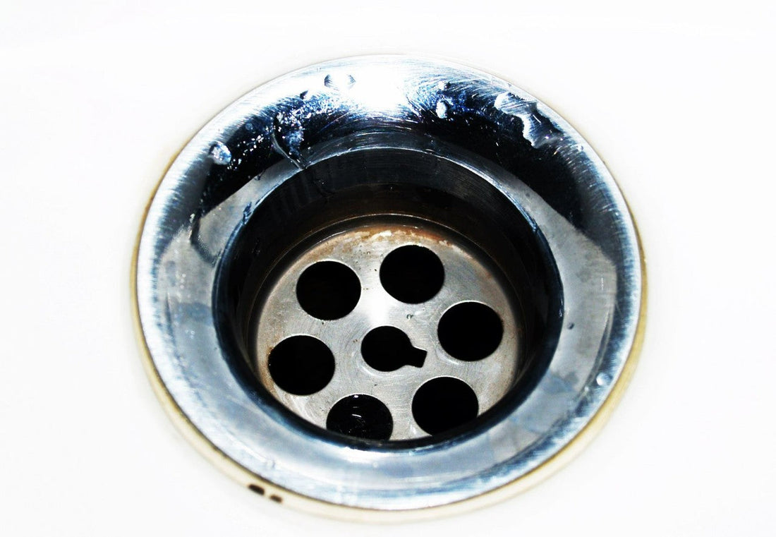 Stainless steel kitchen sink drain viewed from above